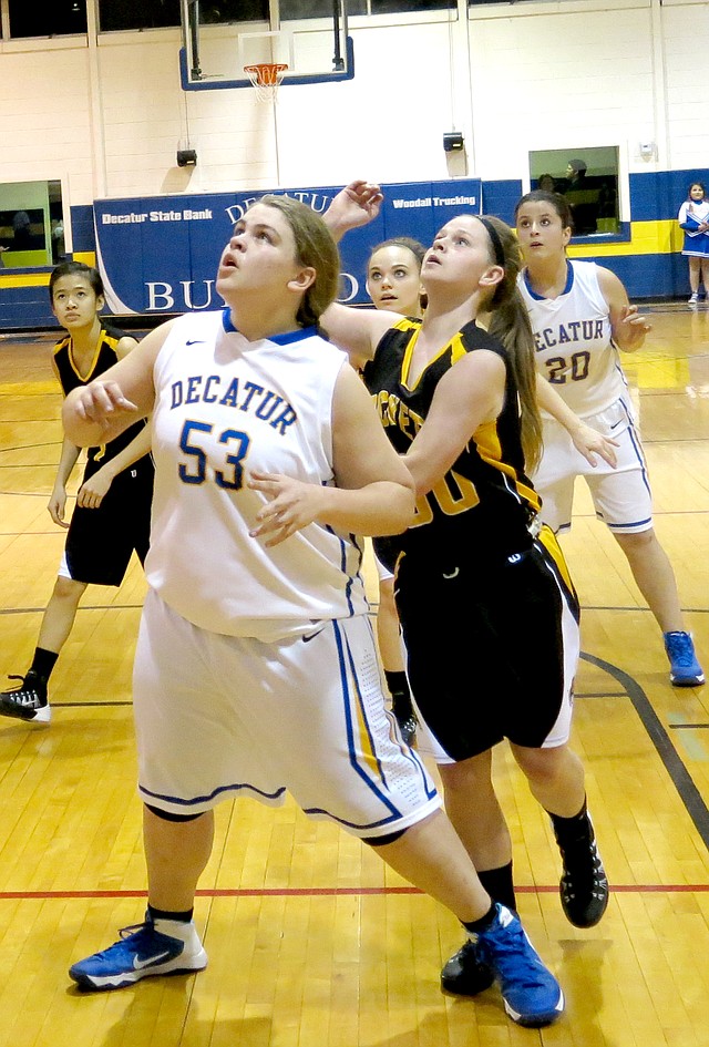 Photo by Mike Eckels Decatur s Hannah Ramsey (#53) blocks a Hackett player from a rebound during their game Feb. 14 at Peterson Gym in Decatur. Ramsey, a three year veteran and captain of the girls basketball team, played her last game at home. The Lady Bulldogs lost 39 to 21.