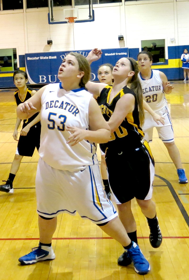 Photo by Mike Eckels Decatur s Hannah Ramsey (#53) blocks a Hackett player from a rebound during their game Feb. 14 at Peterson Gym in Decatur. Ramsey, a three year veteran and captain of the girls basketball team, played her last game at home. The Lady Bulldogs lost 39 to 21.