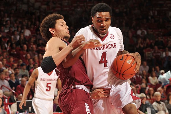 Arkansas forward Coty Clarke tries to drive past South Carolina defender Michael Carrera in the second half of Wednesday's game at Bud Walton Arena in Fayetteville.