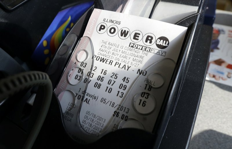 A Powerball lottery ticket is printed out of a lottery machine at a convenience store in Chicago on in this May 18, 2013, file photo. According to lottery officials there were no jackpot winner for Saturday Feb. 15, 2014 drawing. The current estimated jackpot for Wednesday's drawing's jackpot is estimated at $400 million or $227.8 million in cash value. 