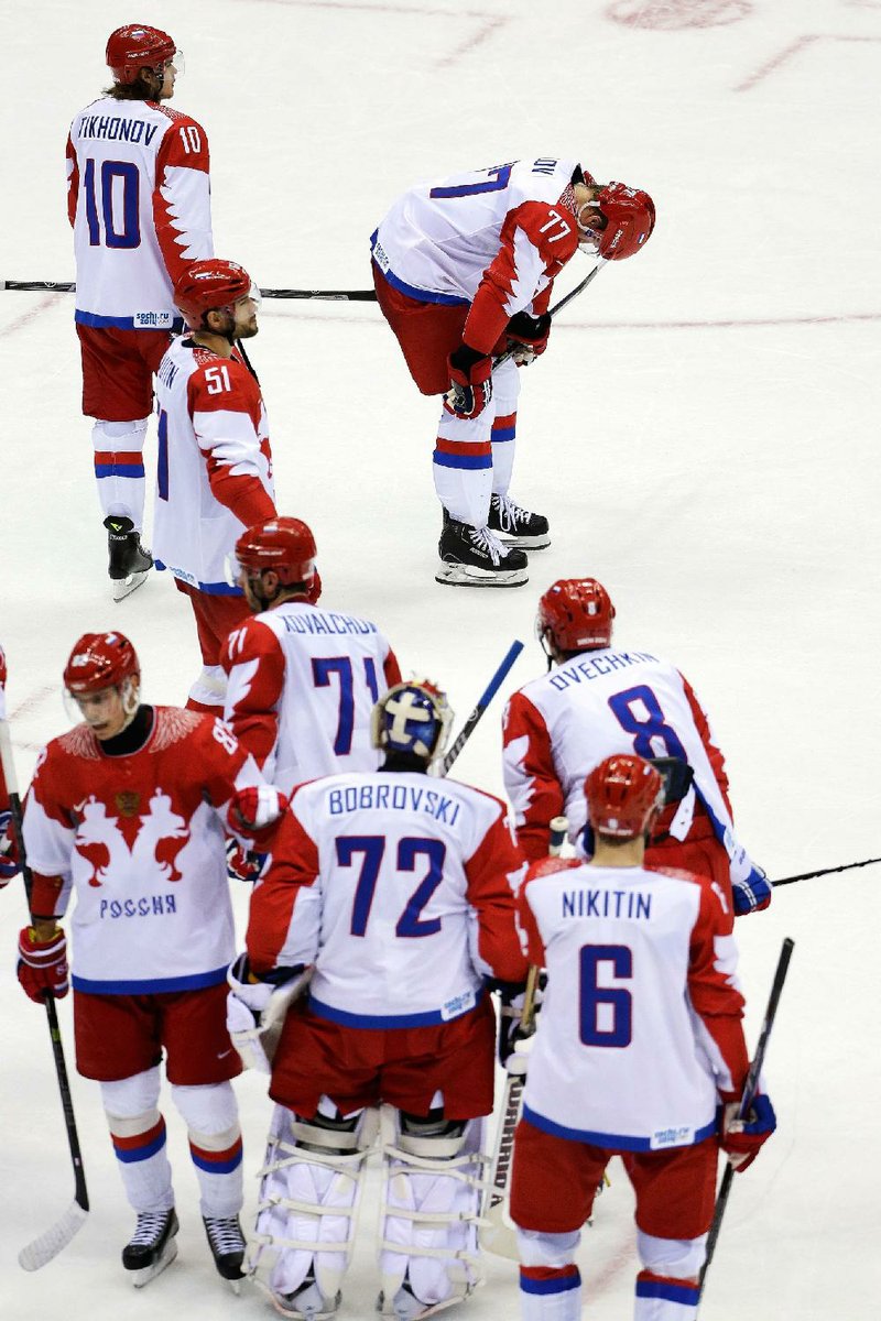 Members of Team Russia stand on the ice after a 3-1 loss to Finland in a men’s quarterfinal game in Bolshoy Arena in Sochi, Russia. The loss eliminated the team from medal consideration. 