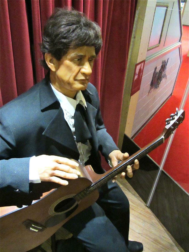 Visitors to the Arkansas Entertainers Hall of Fame in Pine Bluff are greeted by an animatronic Johnny Cash. The figure strums the guitar when a button is pressed, as six songs play. 