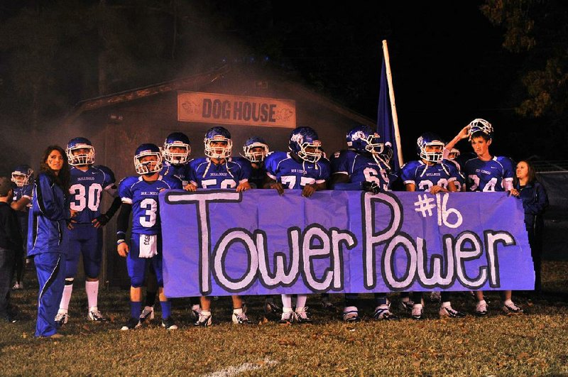 Star City teammates hold up a banner in tribute to Zack Towers in this Nov. 9, 2012 file photo.