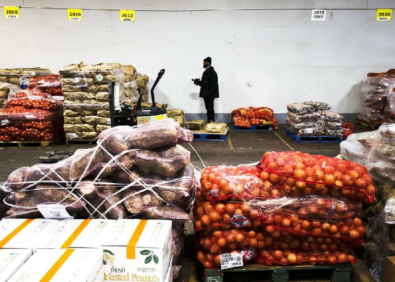 Vegetables are stacked last month in a Philadelphia warehouse owned by Procacci Brothers, one of the nation’s largest produce distributors. The Producer Price Index, a measure of wholesale inflation, rose 0.2 percent in January. 