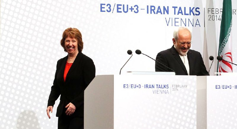 European Union High Representative Catherine Ashton and Iranian Foreign Minister Mohammad Javad Zarif, right, speak to the press after closed-door nuclear talks in Vienna, Austria, Thursday, Feb. 20, 2014. Iran and six world powers are back at the negotiating table eager to come to terms on a comprehensive nuclear deal but deeply divided on what it should look like. The two sides began meeting Tuesday in attempts to build on a first-step accord that temporarily curbs Tehran's nuclear activities in exchange for some sanctions relief. (AP Photo/Ronald Zak)