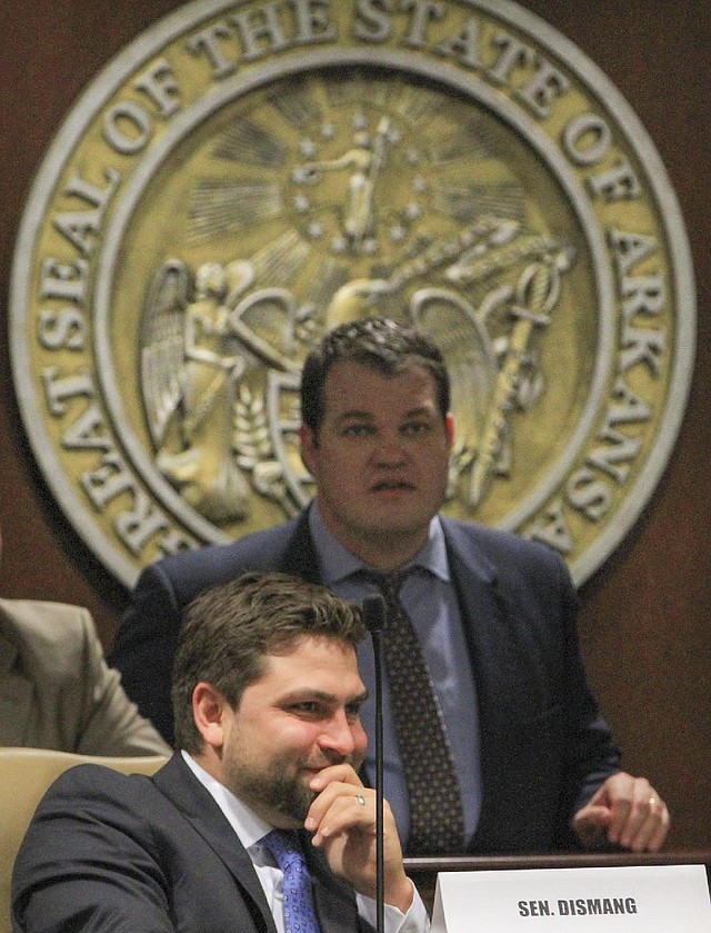 Arkansas Democrat-Gazette/BENJAMIN KRAIN --2/20/14--
Sen. Jonathan Dismang, R-Beebe, bottom, and Senate President Michael Lamoureux, R-Russellville, marooned a bill in committee to curb spending on the lieutenant governor's office staff which continues to employ $267,000 a year on four-member staff.