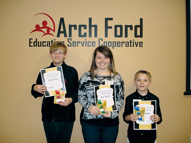 Winners of the inaugural Arch Ford Education Service Cooperative Spelling Bee held Thursday in Plumerville were all Perryville students. The winners are, from the left, first place, Athena Ludwig, sixth grade; second place, Jessi Harwell, eighth grade; and third place, Mason Roland, fourth grade.