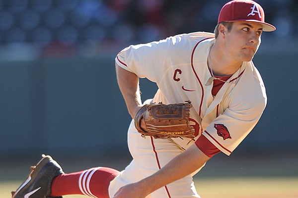 Arkansas junior starter Jalen Beeks delivers a pitch against Eastern Illinois during the second inning Friday, Feb. 21, 2014, at Baum Stadium in Fayetteville.