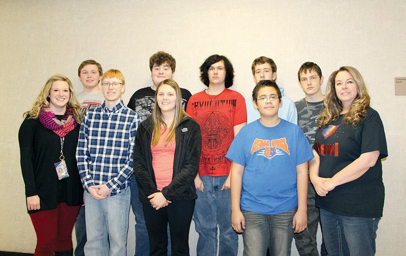 Cedar Ridge High School students, under the supervision of instructor Judy Butler, are working on the Samsung Solve for Tomorrow project. In the front row, from the left, are sophomore Shannon Butler; seniors Bryce Cash and Trish Grissom; seventh-grader Dwight Cabanas; and Butler. In the back row, from the left, are senior Jeffrey Steward; and juniors Jacob Crafton, James Blevins, Daniel Ash and Adam Liles. For their project, the students are working on an emergency-preparedness plan for the community of Newark.