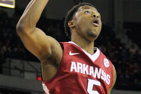 Arkansas' Anthlon Bell (5) celebrates after scoring during the second half of an NCAA college basketball game against Mississippi State in Starkville, Miss., Saturday, Feb. 22, 2014. (AP Photo/Jim Lytle)