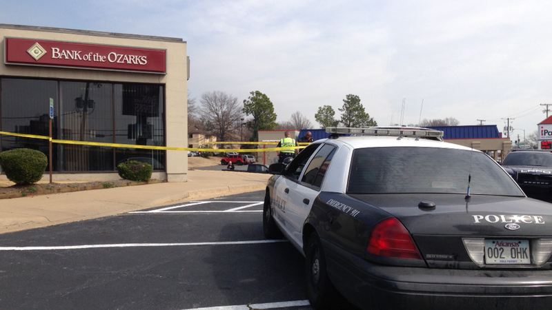 Police respond Monday, Feb. 24, 2014, after the Bank of the Ozarks at 11102 N. Rodney Parham Road in Little Rock was robbed about noon. 
