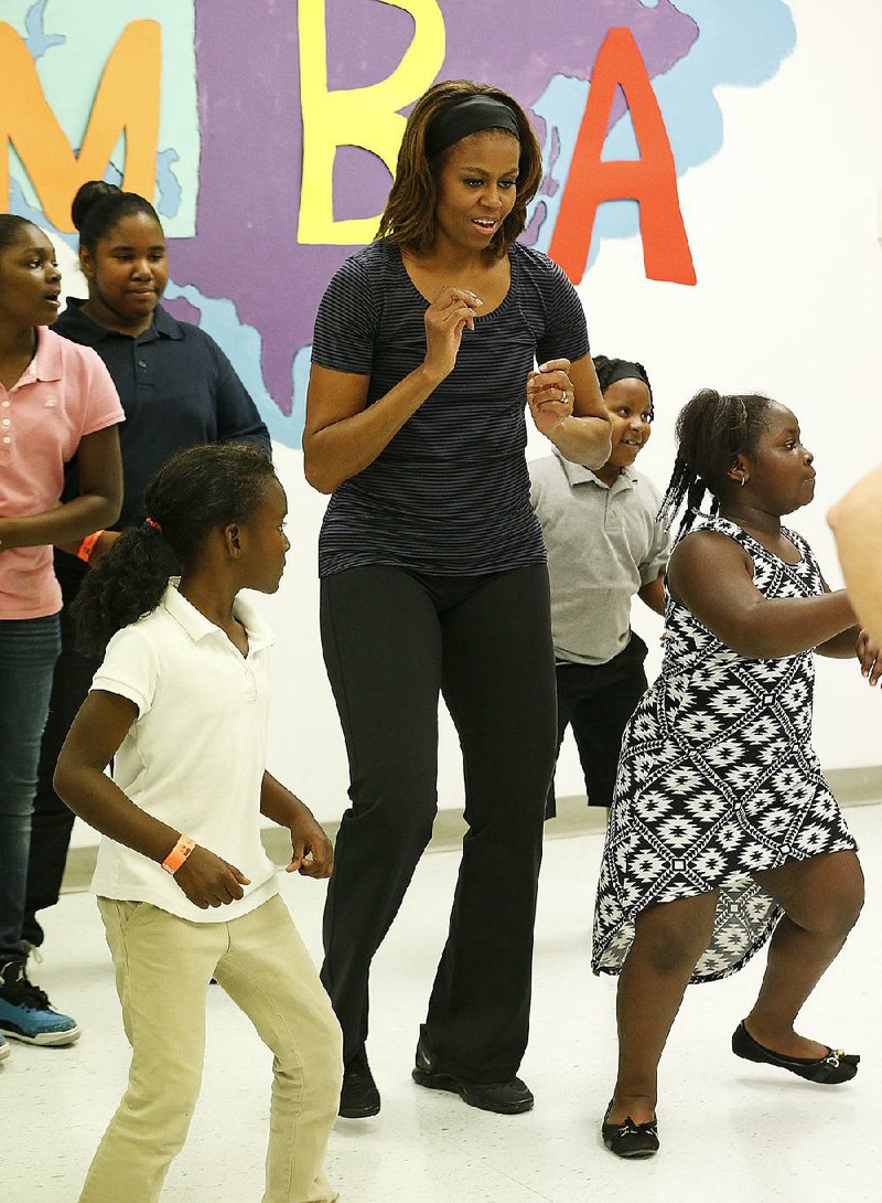 To help mark the fourth anniversary of her “Let’s Move” program, first lady Michelle Obama joins a Zumba session Tuesday at a Miami parks and recreation center. 