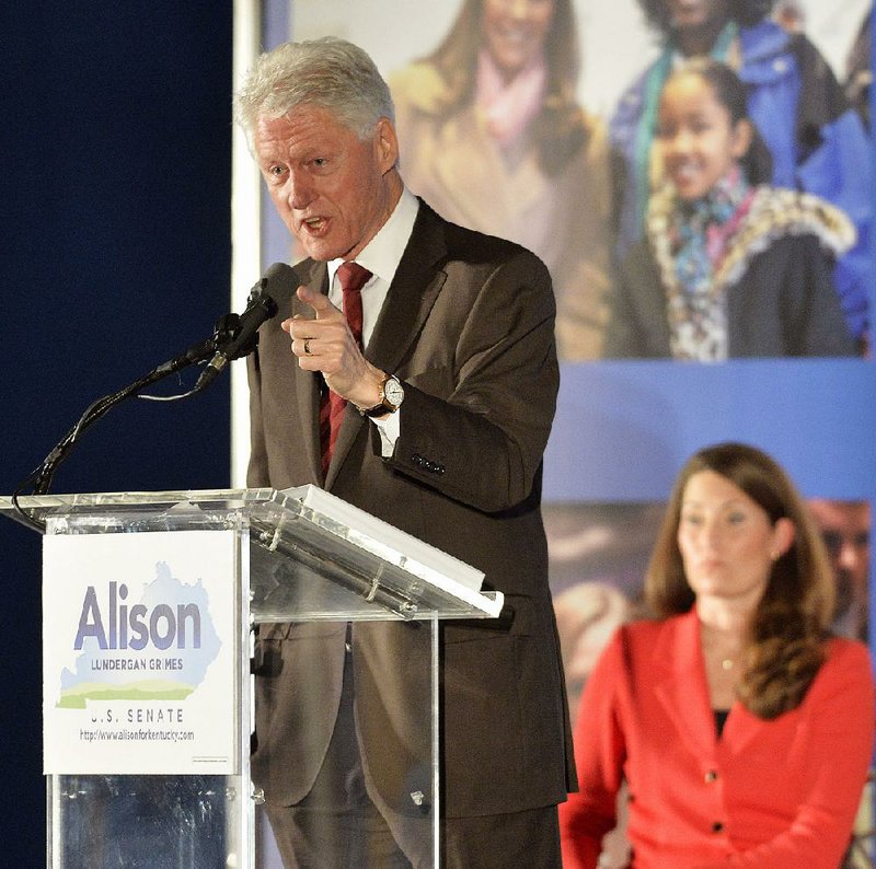 Former President Bill Clinton speaks to a gathering of supporters Tuesday for Democratic U.S. Senate challenger Alison Lundergan Grimes (right) during a fundraiser at the Galt House hotel in Louisville, Ky. 