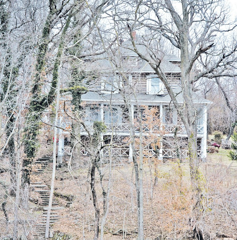 STAFF PHOTO ANTHONY REYES Rabbits Foot Lodge is seen Tuesday on Silent Grove Road in Springdale. Doug Sprouse, Springdale mayor, proposed the city purchase the lodge. The lodge was built in 1908 and was owned by J. William Fulbright when he taught at University of Arkansas law school.