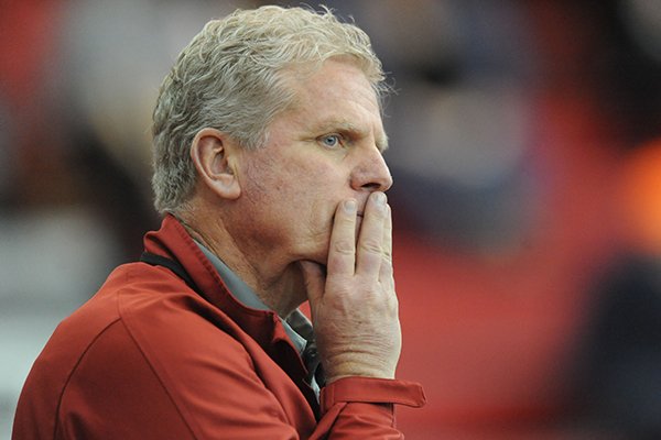 Arkansas coach Chris Bucknam watches during the Razorback Invitational Saturday, Feb. 1, 2014, at the Randal Tyson Track Center in Fayetteville.