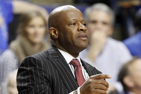 Arkansas coach Mike Anderson watches during the second half of an NCAA college basketball game against Kentucky, Thursday, Feb. 27, 2014, in Lexington, Ky. Arkansas won 71-67 in overtime. (AP Photo/James Crisp)