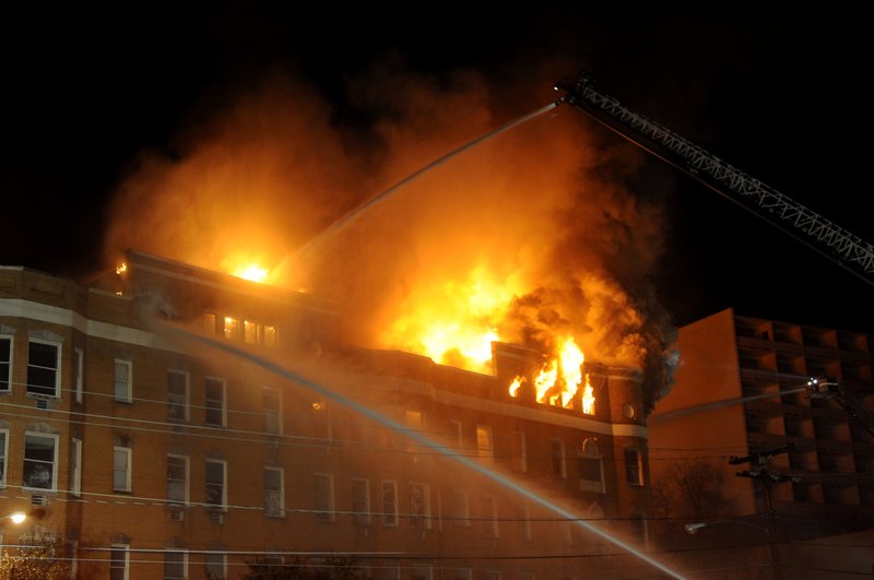 Hot Springs Fire Department firefighters battle a blaze at the vacant Majestic Hotel Thursday, February 27, 2014.