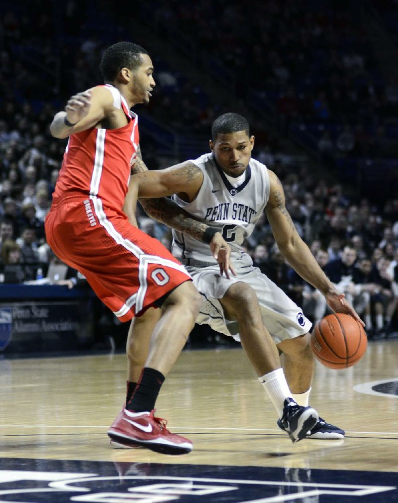 Penn State's D.J. Newbill, right, moves toward the paint around Ohio State's LaQuinton Ross during the first half of an NCAA college basketball game on Thursday, Feb. 27, 2014 in State College, Pa. (AP Photo/Ralph Wilson)