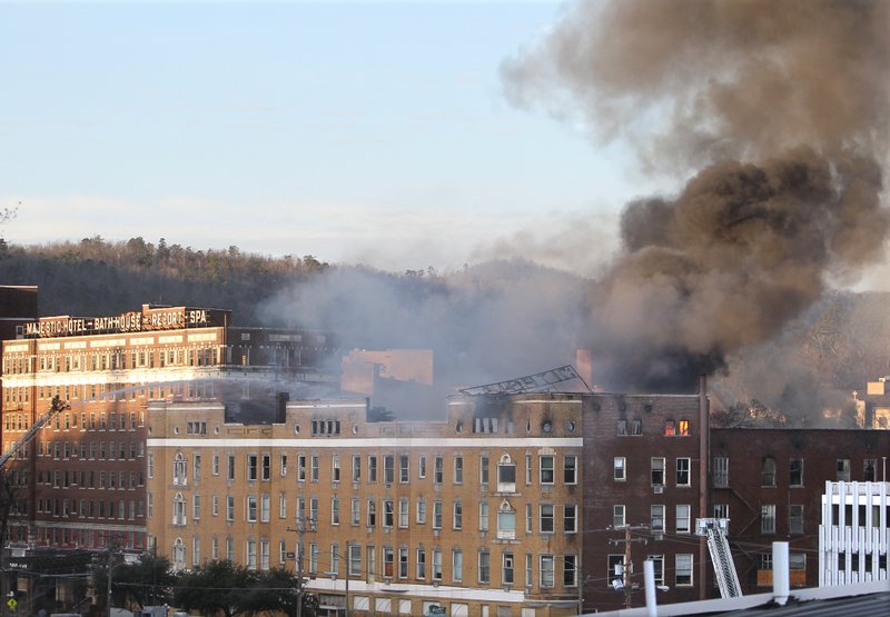 The Sentinel-Record/Richard Rasmussen. Hot Springs firefighters continue to pour water onto the Majestic Hotel Friday morning.