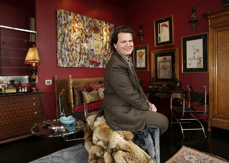 NWA Media/DAVID GOTTSCHALK - 2/18/14 - Chris Goddard sits in one of his favorite personal spaces, the northeast corner of his living room in his Fayetteville home Tuesday morning Feb. 18, 2014.
