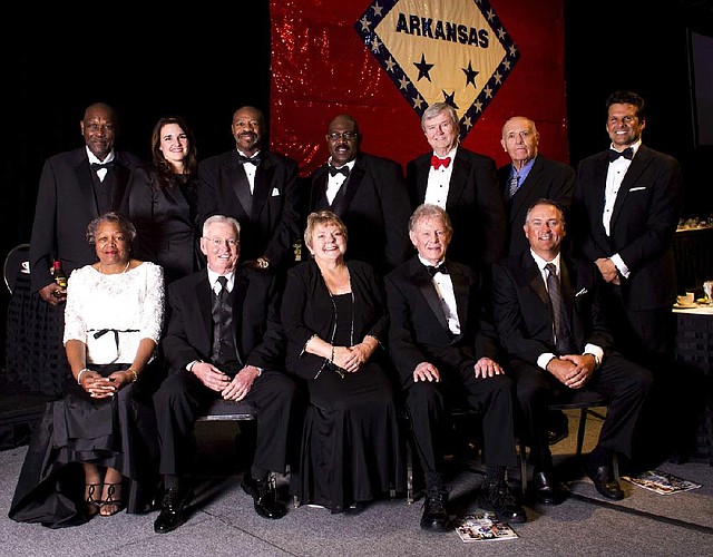 Members of the Arkansas Sports Hall of Fame 2014 class inducted Friday night were (top row, from left) Paul Person (representing Jim Barnes) Stephanie Strack Mathis Bennie Fuller Dennis Winston, Gary Blair, Don Campbell, David Bazzel; (front row, from left) Cordia Metcalf (representing Barnes), Alvy Early, Cheryl Vines (representing Harry Vines), Ken Stephens and Ken Duke.  