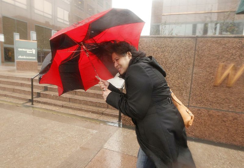 A woman fights strong winds Friday in Los Angeles as a powerful Pacific storm spread rain and snow over much of drought-plagued California. The rain was not expected to do much to relieve the drought, but it did cause traffic snarls, power failures and the threat of mudslides.
