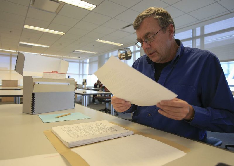 Ron Blome, a Little Rock-based television producer working for NBC News, looks over some of the 4,000 pages of White House documents released Friday at the Clinton Presidential Center. “I was expecting more of a scrum,” Blome said when only a handful of reporters and researchers showed up. The documents also were posted on the library’s website, which quickly slowed and later crashed before getting back up to speed.

