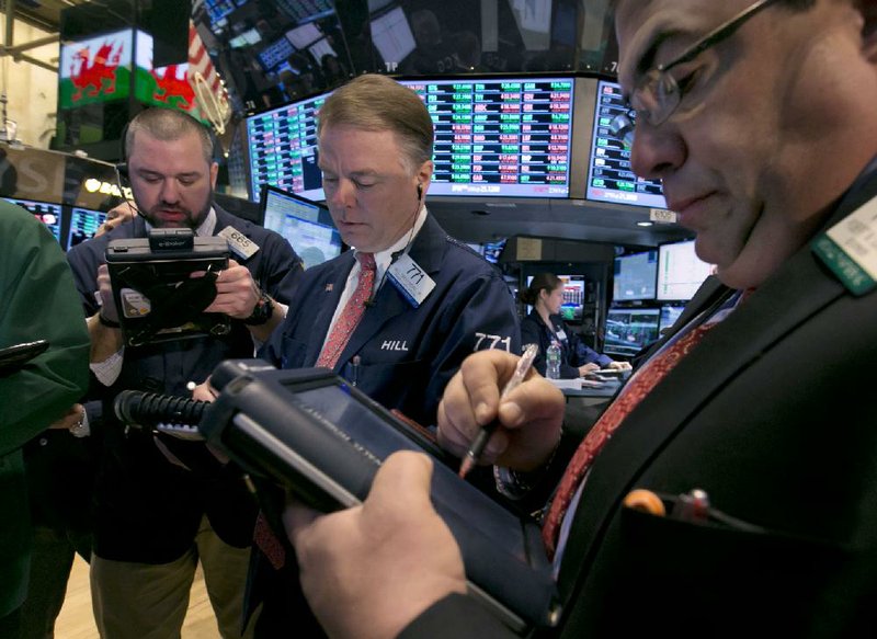 Traders work Friday on the floor of the New York Stock Exchange, where stocks ended the month on a positive note. The Standard & Poor’s 500 index rose about 4 percent in February.
