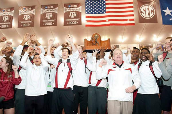 Members of the Arkansas track & field team celebrate their SEC championship Saturday in College Station, Texas. 