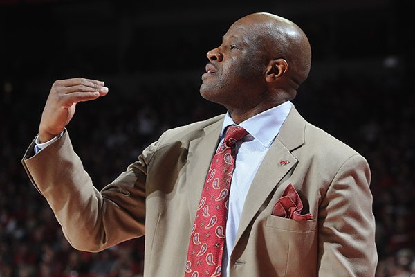 Arkansas' Mike Anderson coaches from the bench Saturday, March 1, 2014, during the second half of the game at Bud Walton Arena in Fayetteville.
