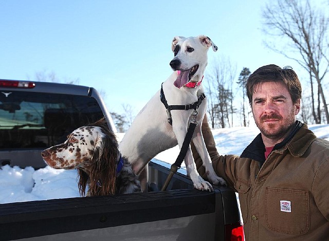 Alan Taylor (with Hank, left) and Boo. She had a tag on when she was shot while getting into a neighbor's coop, he said. "The simple solution for a rational person is to pick up a phone, but what this law allows people to do is to pick up a gun," he added. Illustrates DOGS-CHICKENS (category a), by Rachel Weiner (c) 2014, The Washington Post. Moved Tuesday, Feb. 18, 2014. (MUST CREDIT: Photo for The Washington Post by Norm Shafer)