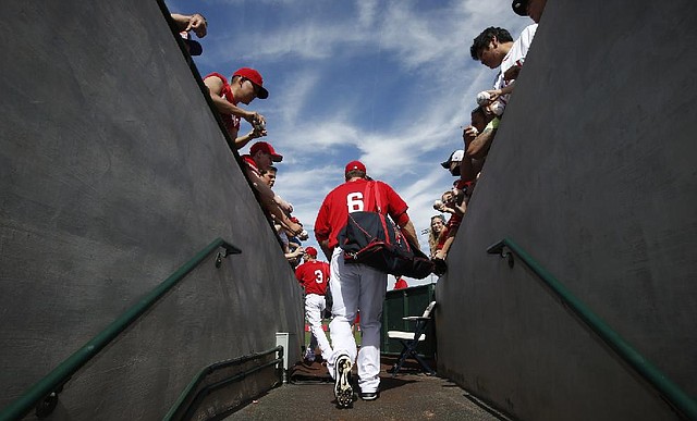 Los Angeles Angels' David Freese (6) walks out of the clubhouse prior to a spring training baseball game against the Chicago Cubs on Friday, Feb. 28, 2014, in Tempe, Ariz. (AP Photo/Ross D. Franklin)