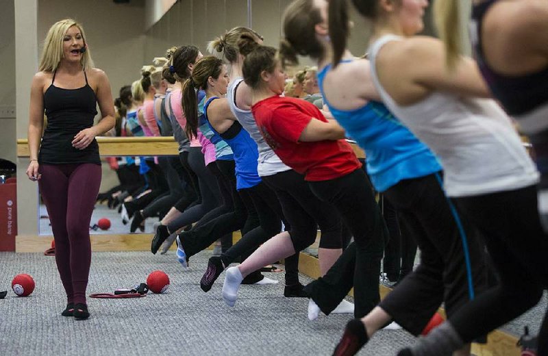 
Arkansas Democrat-Gazette/MELISSA SUE GERRITS 01/29/2014- Lindsey Newton instructor and co-owner of Pure Barre in Little Rock, leads a Pure Barre class January 29, 2014. 