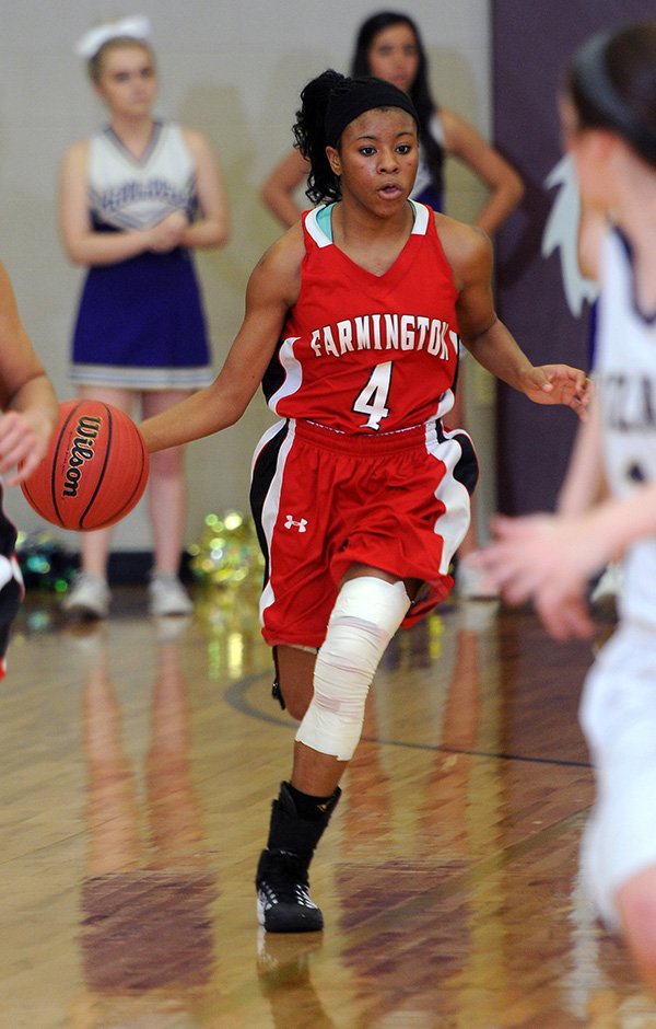 STAFF PHOTO SAMANTHA BAKER @NWASAMANTHA 
Tichina Scales of Farmington drives down the court Saturday during the 4A North Region championship game against Ozark at Lincoln High School.