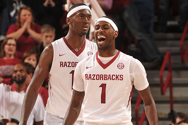 Arkansas players Mardracus Wade and Bobby Portis react after a South Carolina turnover late in the second half of a Feb. 19, 2013 game at Bud Walton Arena in Fayetteville.