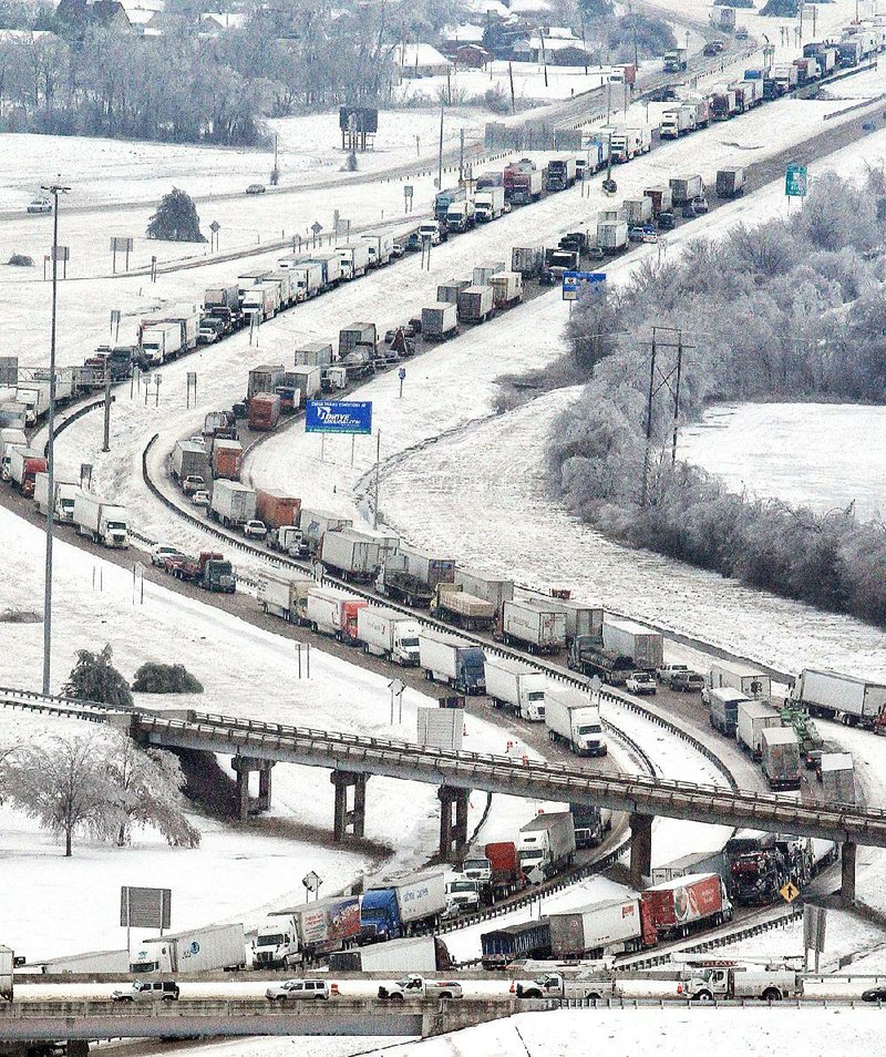 Traffic backs up in all directions Tuesday on Interstate 40 at West Memphis, one of several snarled spots on I-40 and Interstate 55 in eastern Arkansas. 