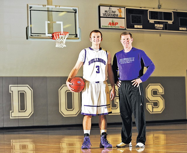 STAFF PHOTO ANDY SHUPE 
Kyle Adams, Fayetteville basketball coach, has had the pleasure to coach his son, senior guard Mason Adams, this season.