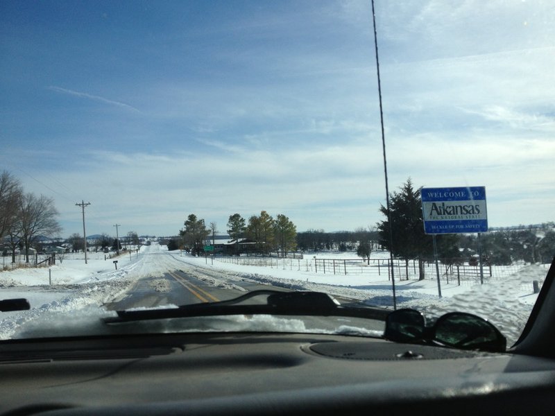 Missouri Route 39 is clear Monday, March 3, 2014, while Arkansas 221 remains icy north of Berryville.