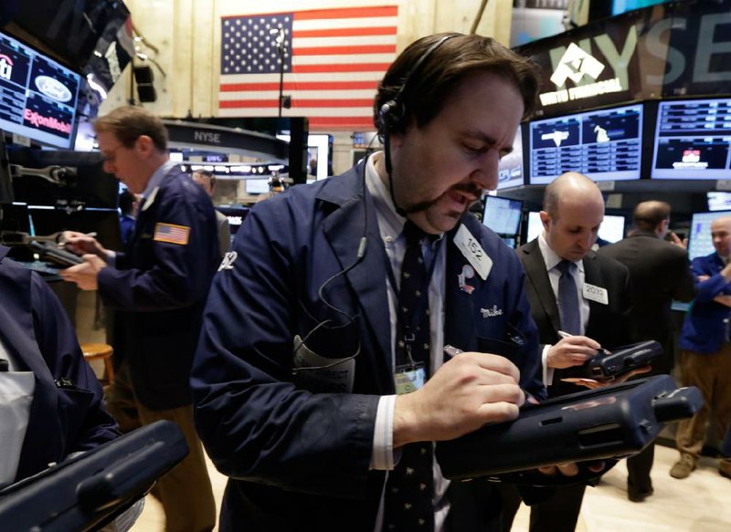 Trader Michael Mozian works Wednesday on the floor of the New York Stock Exchange. 