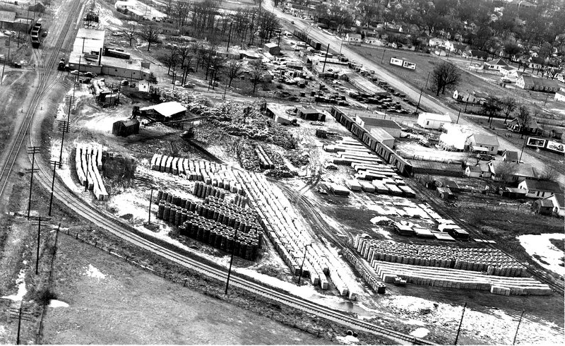 Courtesy Photo Clayton Eversole Square and round stakes of staves sit ready to be shipped to make whiskey barrels from the Eversole Stave Mill in Rogers in 1950.