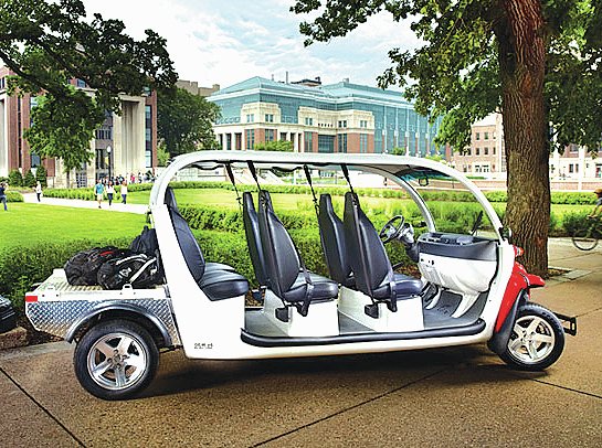 Courtesy Photo Cole Stocking, a graduate student at the Sam M. Walton College of Business, plans to roll out a small fleet of Global Electric Motorcars in Fayetteville next month through a company called Piggy Back.