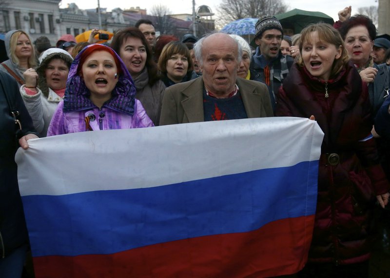 On Wednesday, March 5, 2014, pro-Russian supporters chant slogans during a rally at a central square in Simferopol, Ukraine. Ukraine is facing a potentially crippling geographic and cultural divide, a growing gulf between supporters of Russia who dominate the east and south of the country, and western Ukrainians who yearn for closer ties to Western Europe. One side of that divide is even starker in Crimea, a Black Sea peninsula. For much of the past 200 years, Crimea was under Russian and Soviet control, and today most Crimeans see themselves as only nominally Ukrainian and Russian is, by far, the dominant language.