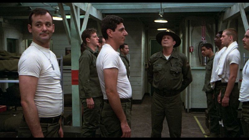 Still photo from Stripes: (from left) Bill Murray, Judge Reinhold, Harold Ramis, Warren Oates 