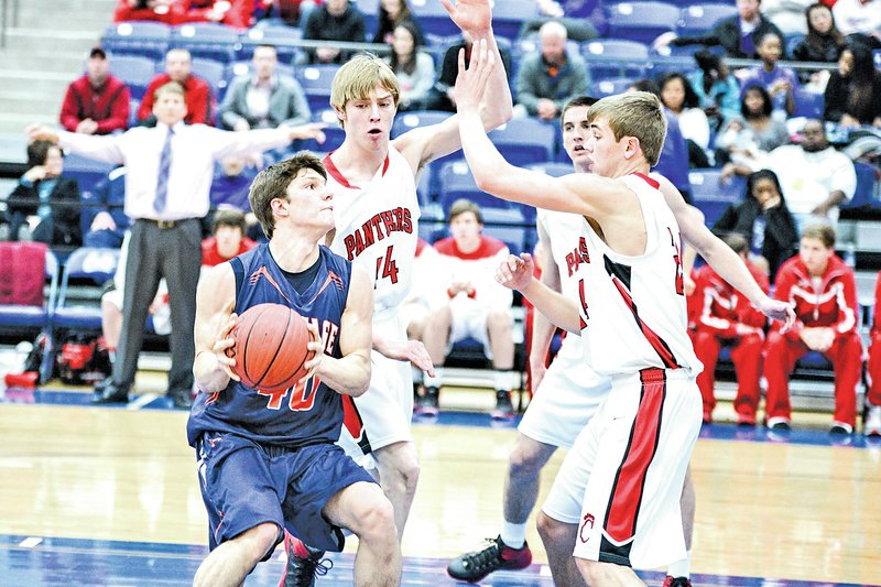  Special To NWA Media Jaison Sterling Connor Hirsh, Rogers Heritage forward, goes up for a shot Thursday against several Cabot defenders during the first round of the Class 7A state playoffs in Conway.