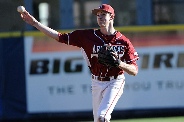 Arkansas second baseman Brian Anderson throws to first base during a game Friday, March 7, 2014 at Evans Diamond in Berkeley, Calif.