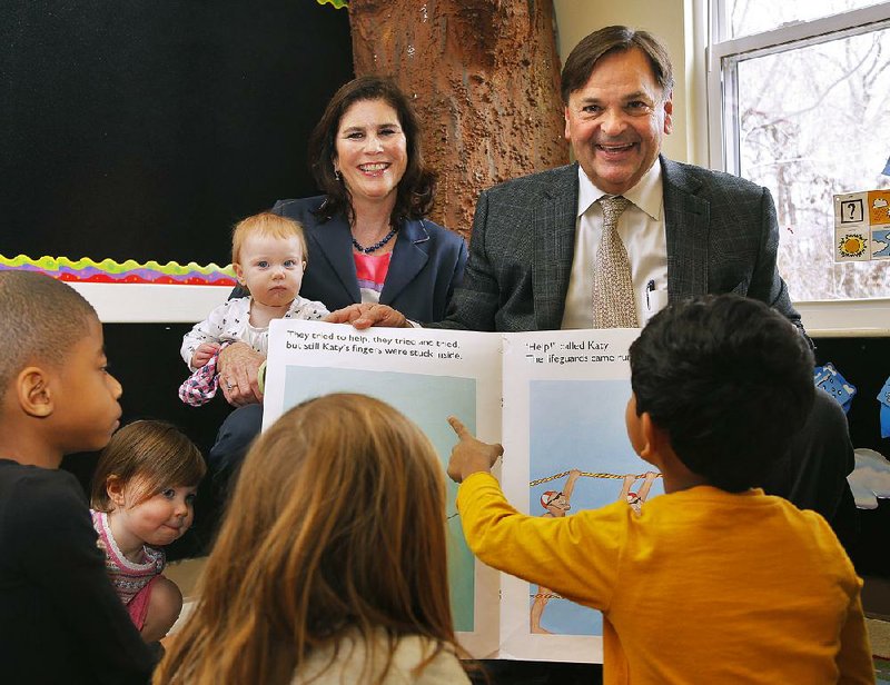 Arkansas Democrat-Gazette/JOHN SYKES JR - HIGH PROFILE VOLUNTEER -  Lynn and George O'Conner at the ACCESS School in Little Rock. Elijah, Louisa, Georgia, Mabry and Suyog enjoy listening to a story at ACCESS.021714