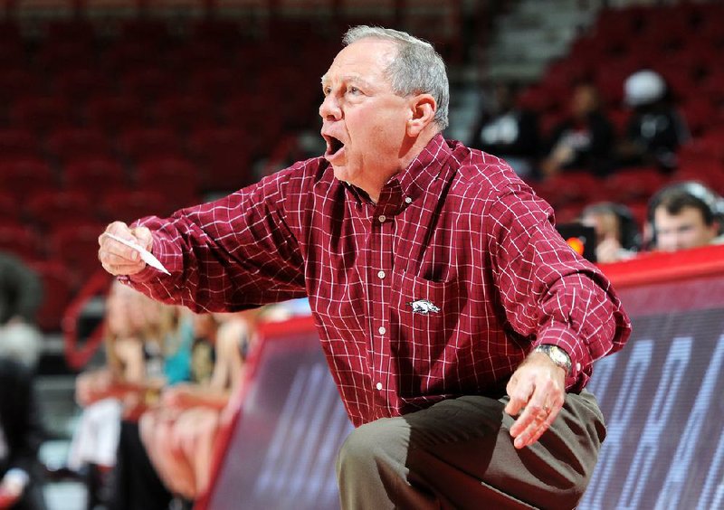 STAFF PHOTO SAMANTHA BAKER w @NWASAMANTHA
Tom Collen, Arkansas women's basketball head coach, yells from the bench Sunday, Nov. 24, 2013, during the second half of the game against Western Michigan at Bud Walton Arena in Fayetteville. Arkansas beat Western Michigan, 61-46.