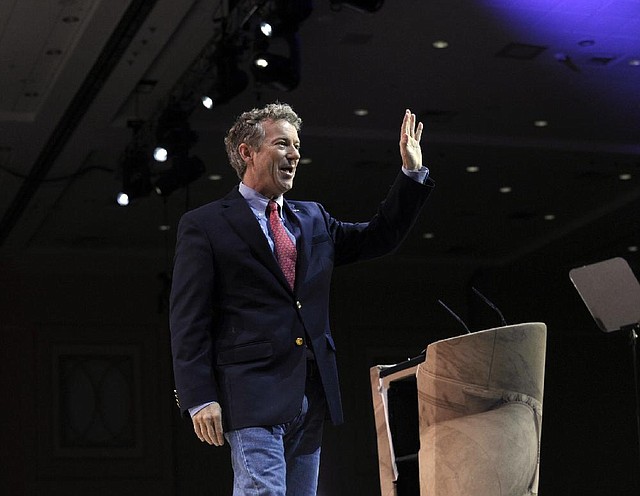 Sen. Rand Paul, R-Ky., waves to the crowd after speaking at the Conservative Political Action Committee annual conference in National Harbor, Md., Friday, March 7, 2014. Friday marks the second day of the annual Conservative Political Action Conference, which brings together prospective presidential candidates, conservative opinion leaders and tea party activists from coast to coast. (AP Photo/Susan Walsh)