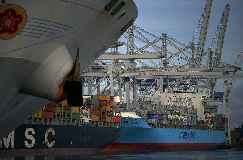 Container ships are moored at the Georgia Ports Authority Garden City terminal in Savannah, Ga., in January. Though the U.S. trade deficit increased slightly in January, one analyst expects the deficit to trend downward this year as the U.S. energy deficit shrinks. 