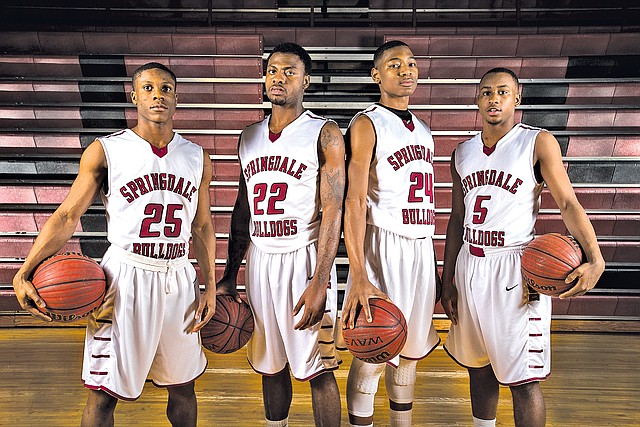  STAFF PHOTO ANTHONY REYES TreShawn Gause, from left, D.J. Evans, Chris Owen and Tereke Eckwood of Springdale form a tight-knit core the the Bulldogs&#8217; basketball team. Evans, Owens and Eckwood are the three leading scorers, while Gause provides defense off the bench.